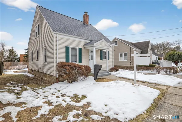 a view of a house with snow on the background