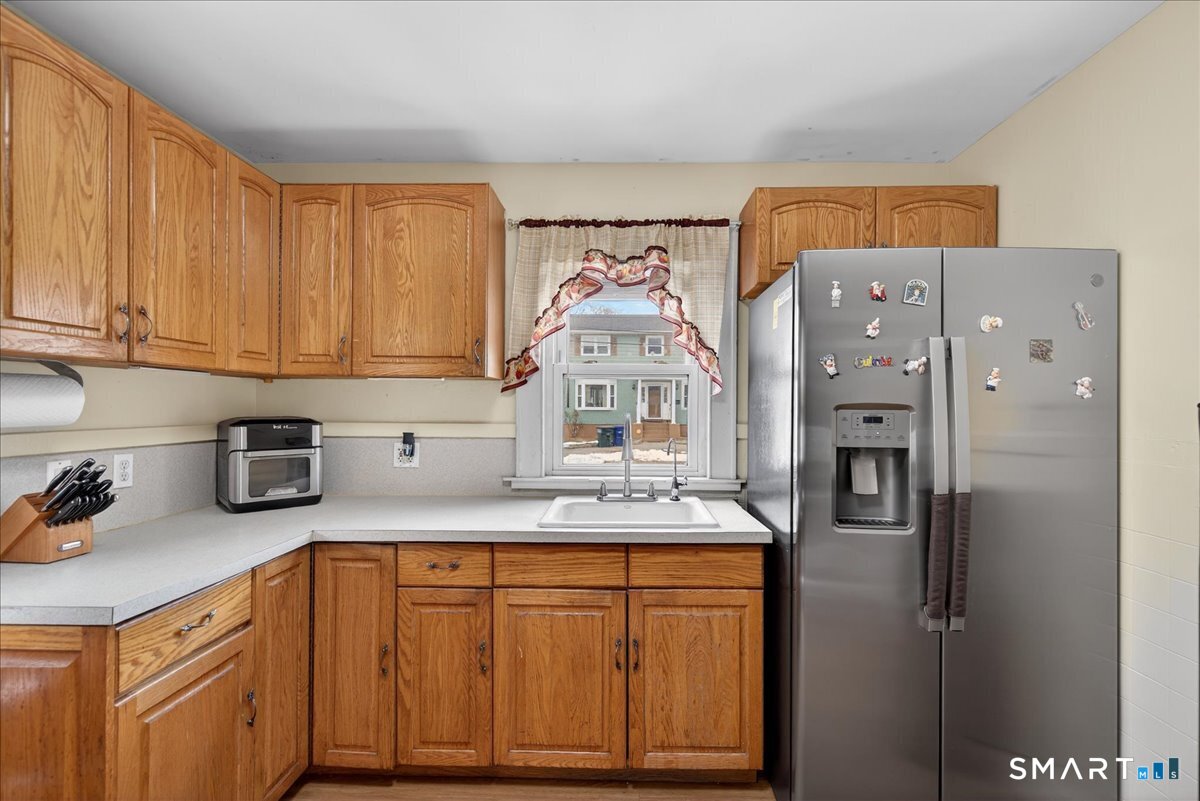 35 Marcel Street Bridgeport, CT 06606 - Photo 2 of 40 a kitchen with stainless steel appliances granite countertop a refrigerator and a sink