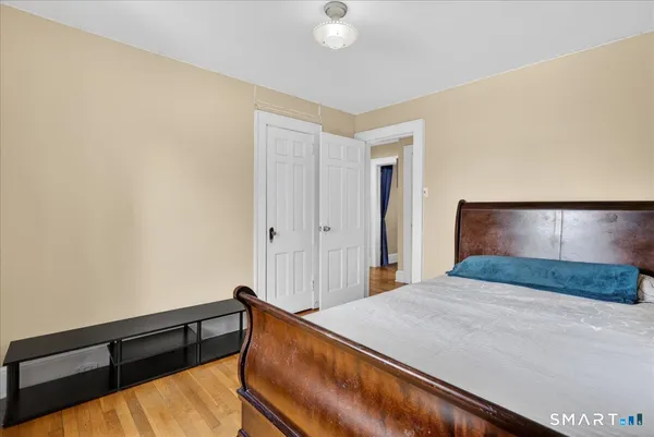 a bedroom with a bed and a table in it