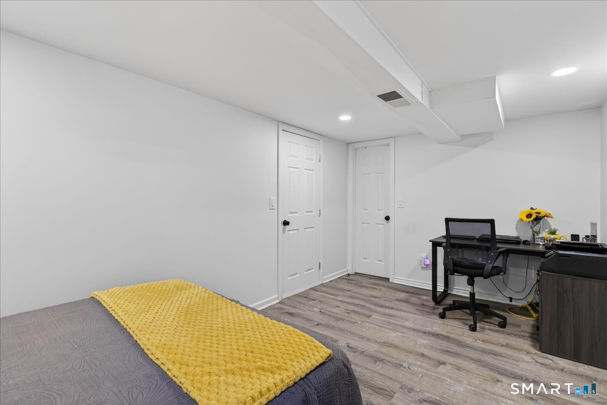 35 Marcel Street Bridgeport, CT 06606 - Photo 37 of 40 a workspace with furniture and wooden floor