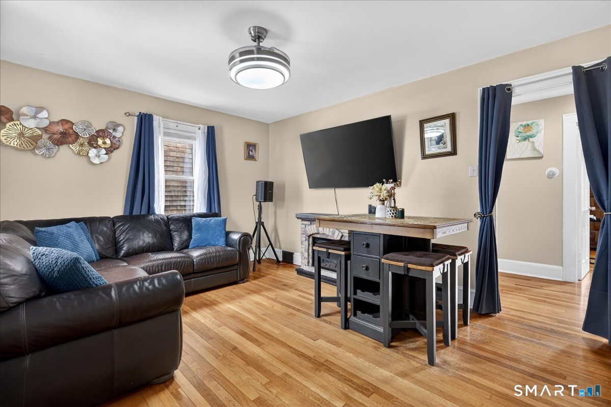 35 Marcel Street Bridgeport, CT 06606 - Photo 10 of 40 a living room with furniture and a flat screen tv