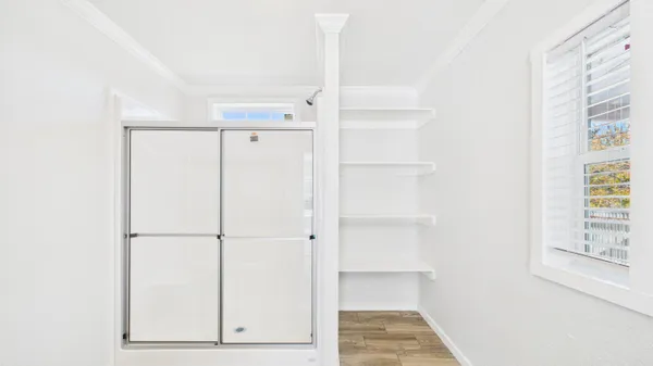 a view of walk in closet with window