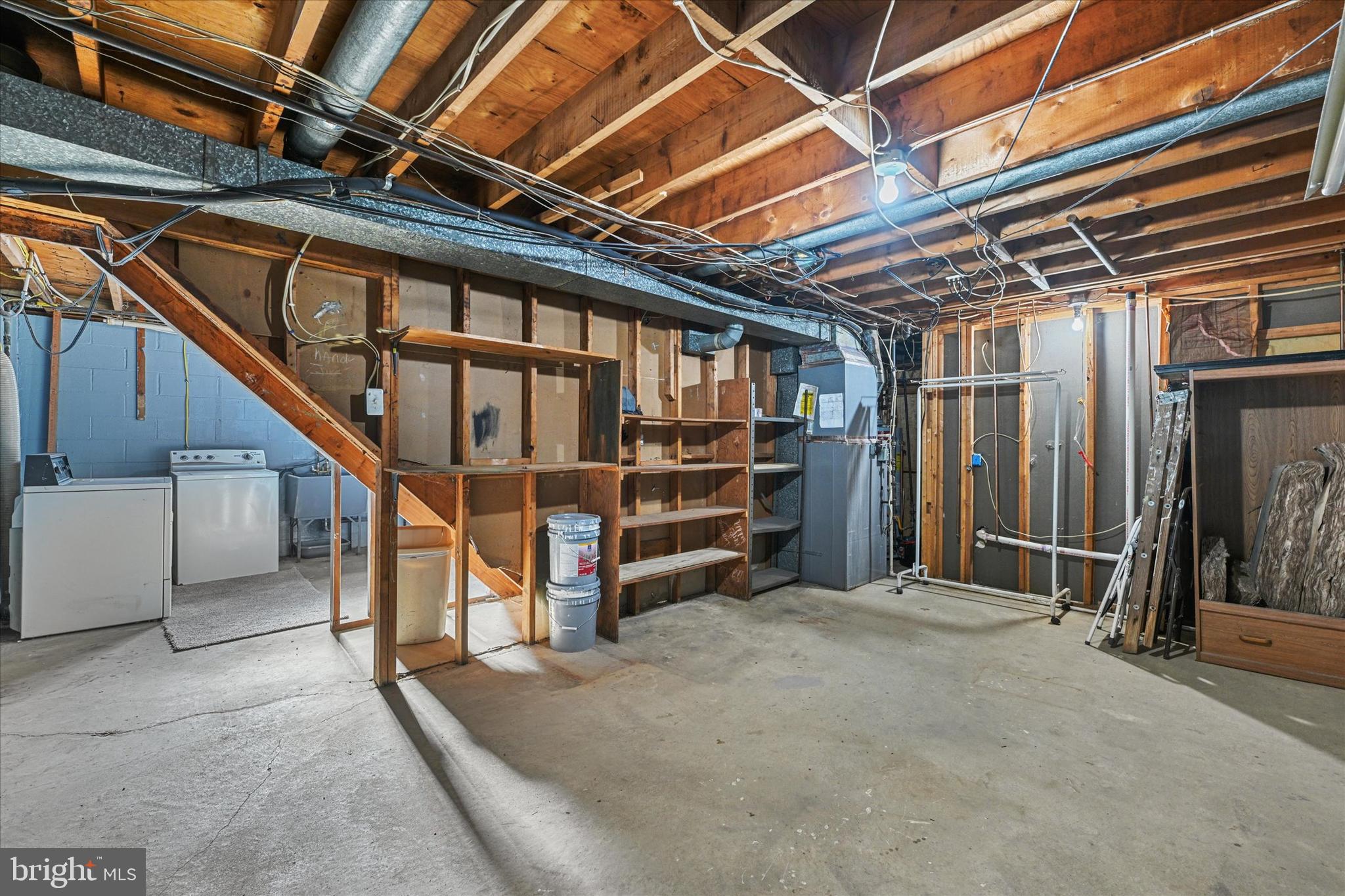 519 Holy Cross Road Brooklyn, MD 21225 - Photo 23 of 32 Lower Level Laundry & Storage Area
