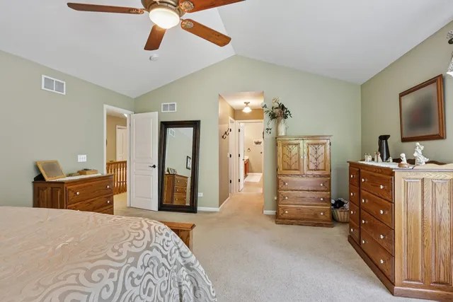 a bedroom with furniture and a flat tv screen