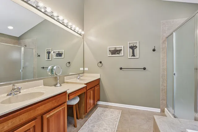 a bathroom with a double vanity sink and a mirror