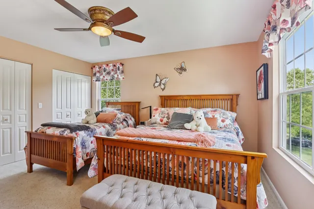 a bedroom with bed and a window