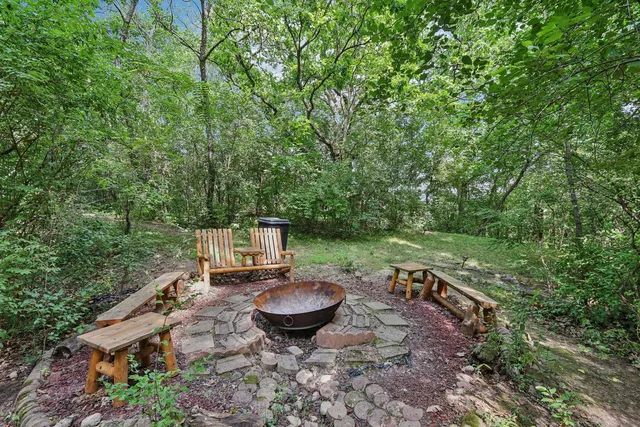 a view of a backyard with sitting area