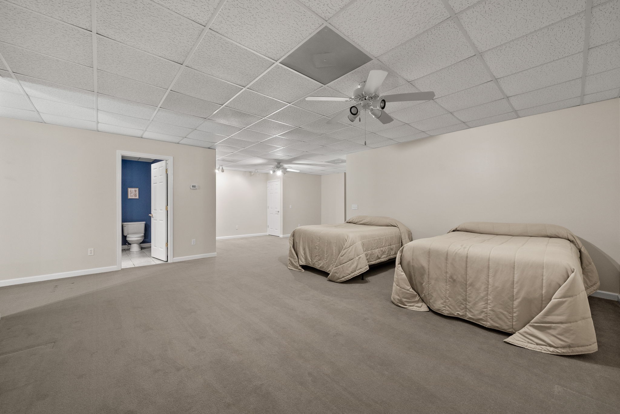 202 Partridge Point Cadiz, KY 42211 - Photo 38 of 100 a spacious bedroom with a bed and a chandelier