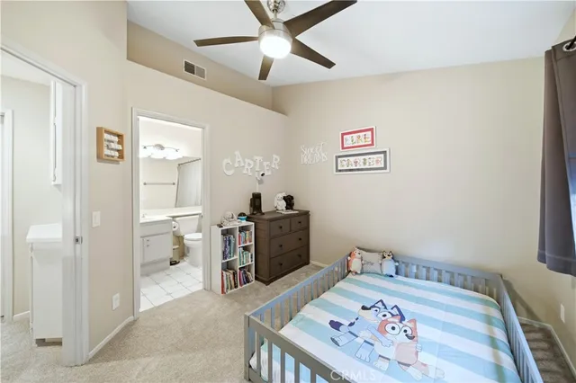 a bed room with a bed and a chandelier