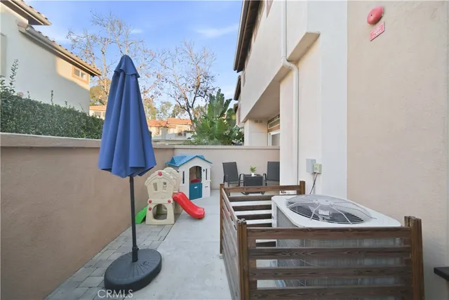 a kitchen with a sink a stove and a potted plant