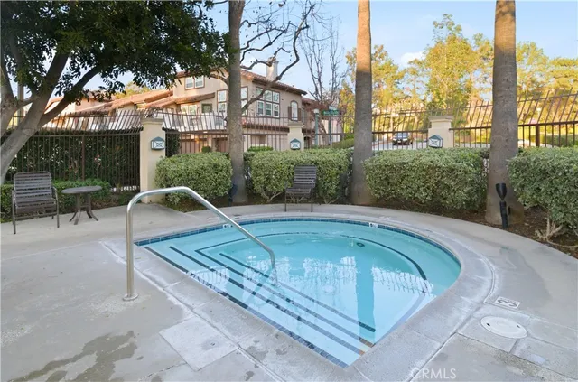 a view of a swimming pool with a patio