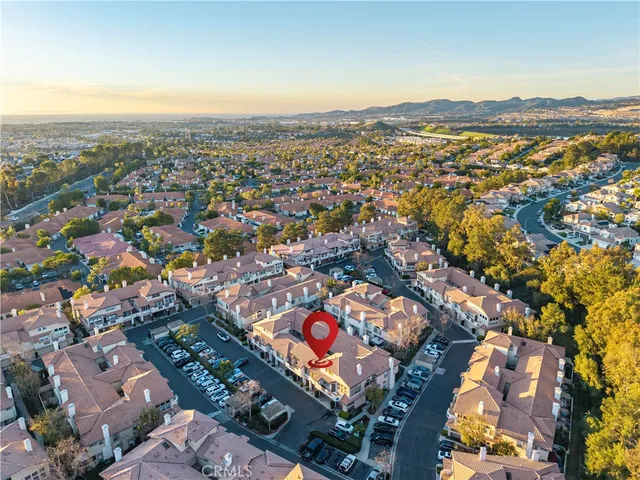 an aerial view of residential building and ocean view