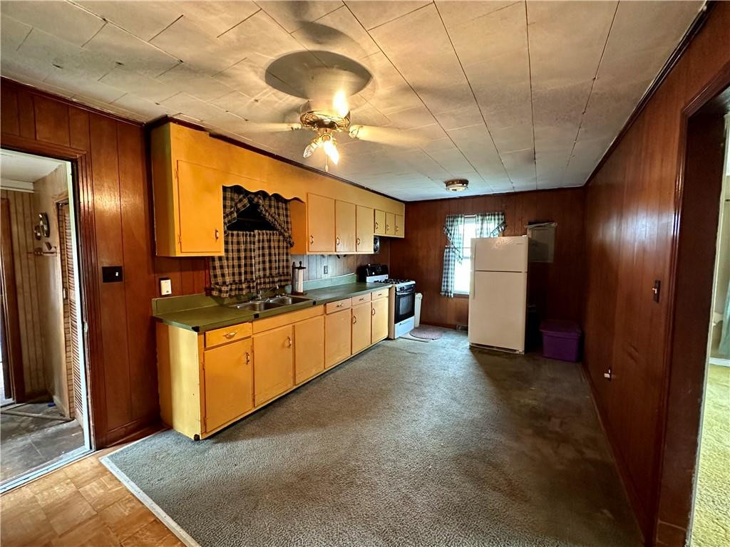5545 Woodsdale Road Roxboro, NC 27574 - Photo 12 of 24 a large kitchen with cabinets and stainless steel appliances