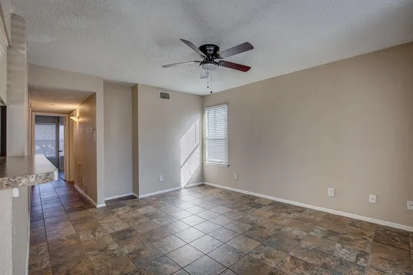 a view of an empty room and window
