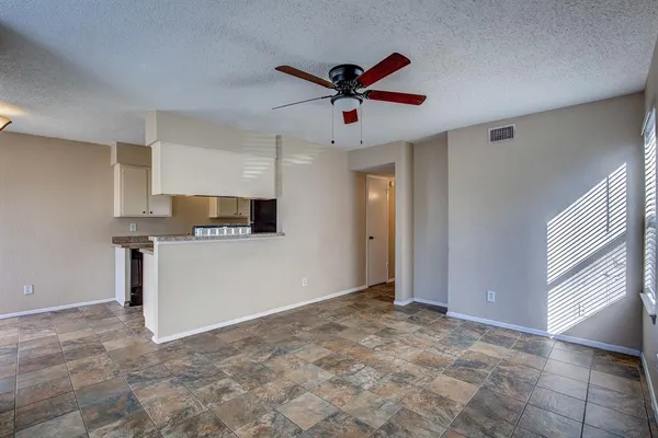 a view of a livingroom with a ceiling fan