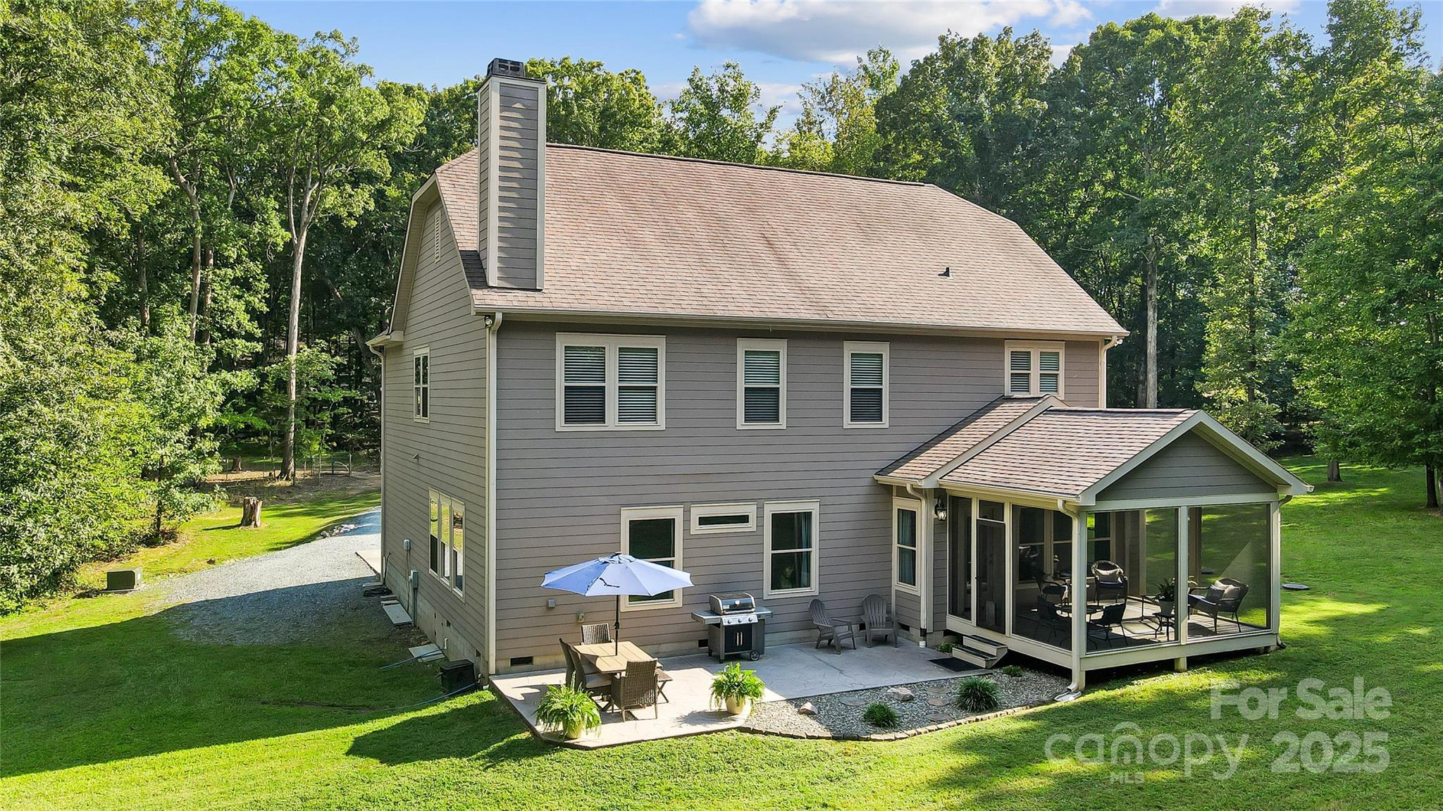7219 Indian Trail Fairview Road Indian Trail, NC 28079 - Photo 12 of 48 a aerial view of a house with swimming pool and porch with furniture