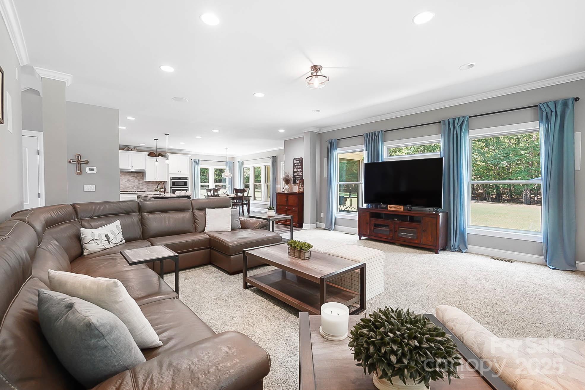 7219 Indian Trail Fairview Road Indian Trail, NC 28079 - Photo 17 of 48 a living room with furniture and a flat screen tv