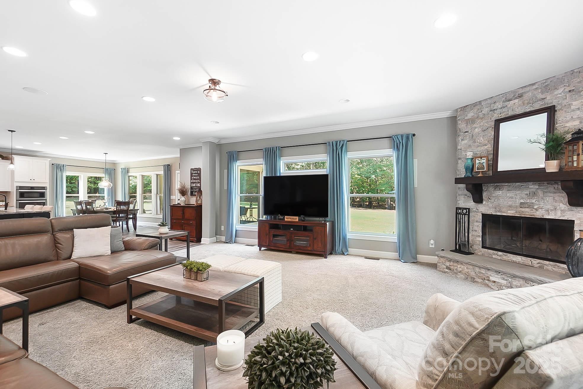7219 Indian Trail Fairview Road Indian Trail, NC 28079 - Photo 18 of 48 a living room with furniture and a flat screen tv