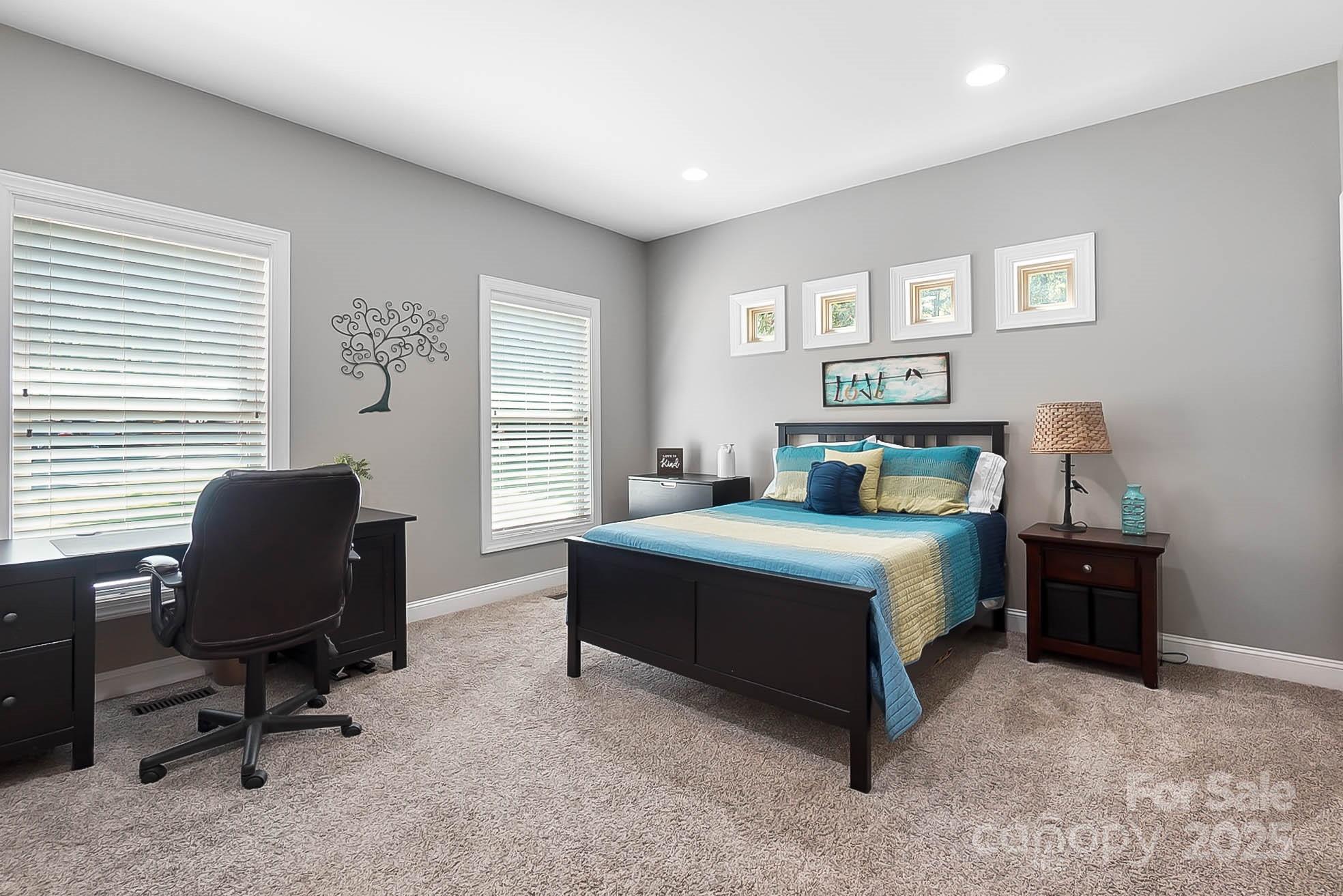7219 Indian Trail Fairview Road Indian Trail, NC 28079 - Photo 29 of 48 a bedroom with a bed and a desk