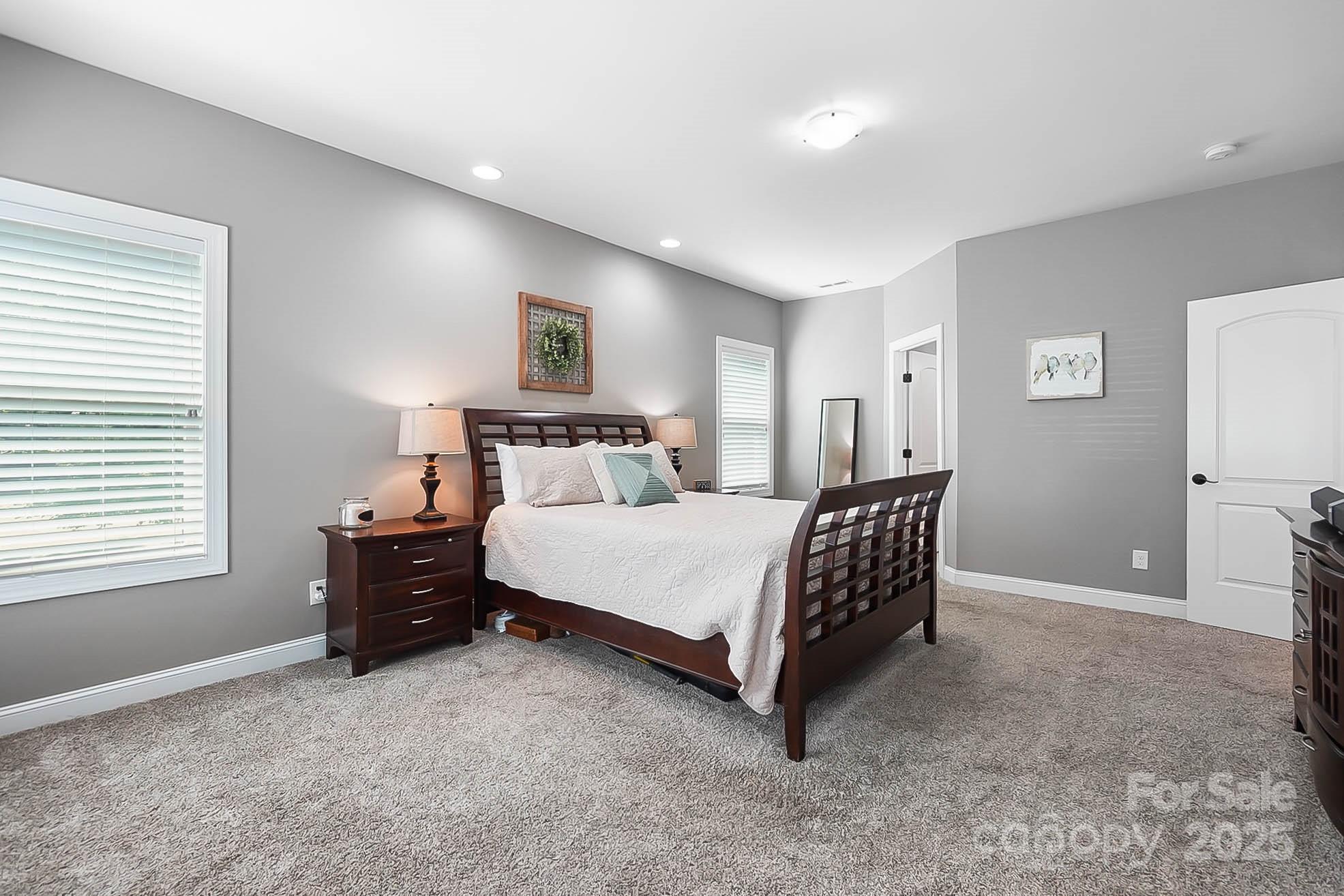 7219 Indian Trail Fairview Road Indian Trail, NC 28079 - Photo 32 of 48 a bedroom with a bed and a window