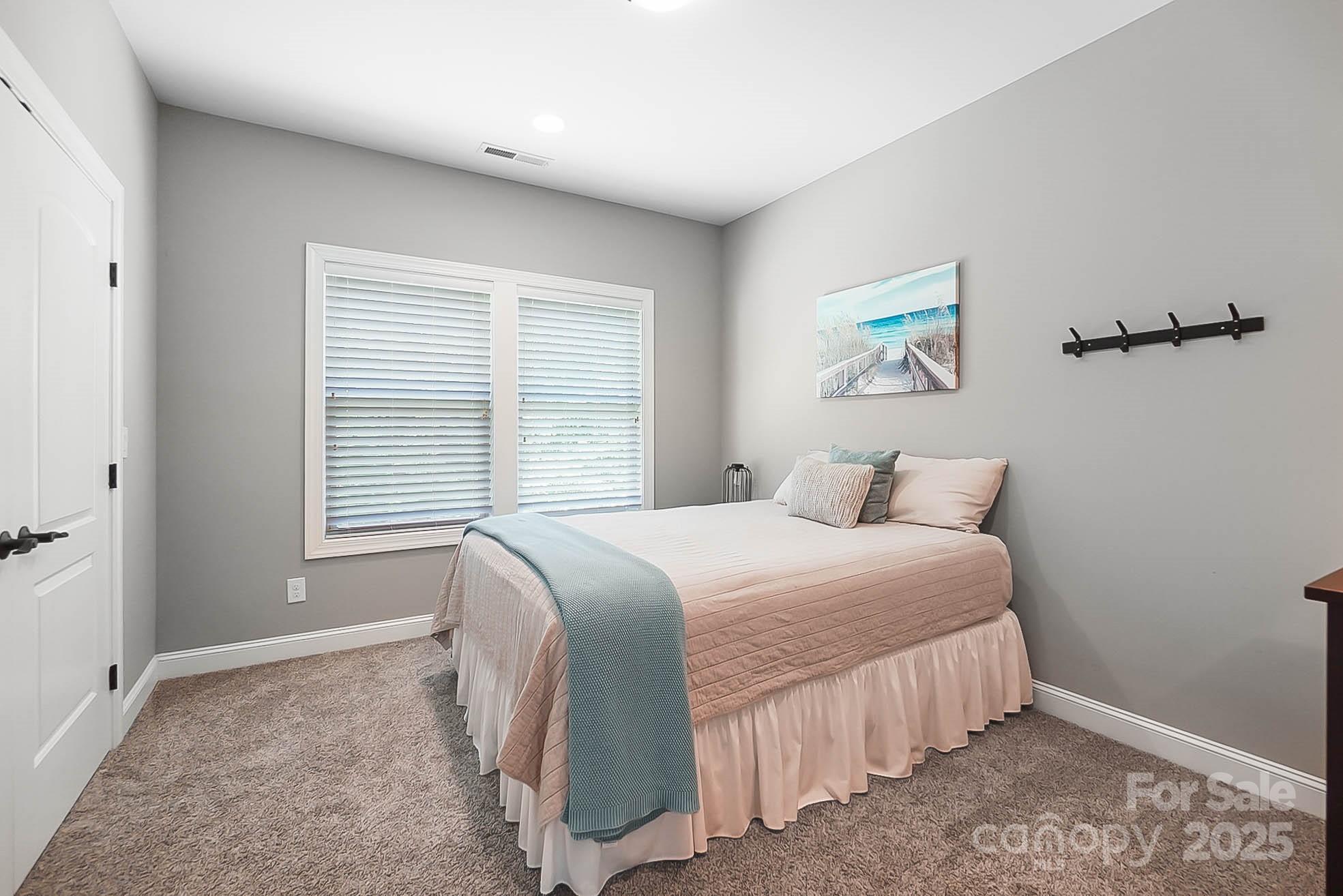 7219 Indian Trail Fairview Road Indian Trail, NC 28079 - Photo 38 of 48 a bedroom with a bed and a window