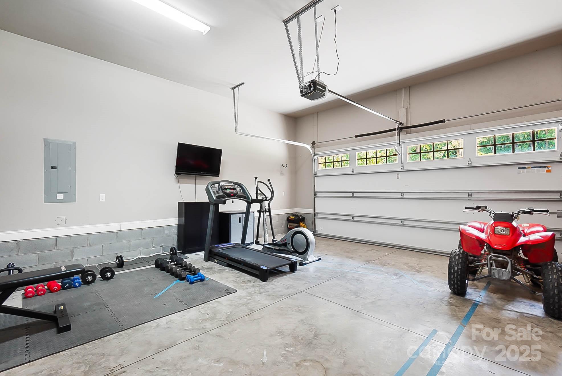 7219 Indian Trail Fairview Road Indian Trail, NC 28079 - Photo 41 of 48 a room with gym equipment and a mirror