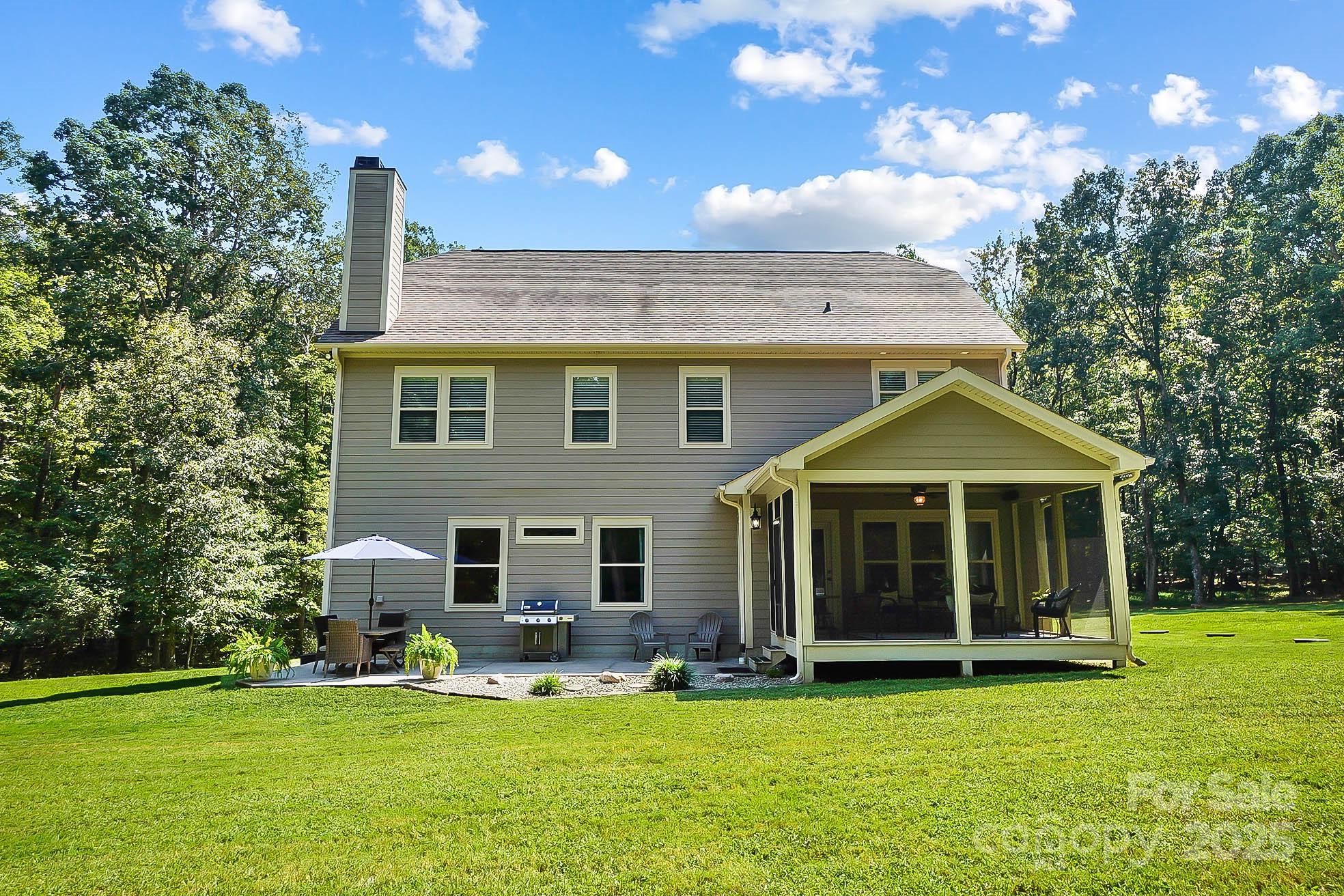 7219 Indian Trail Fairview Road Indian Trail, NC 28079 - Photo 46 of 48 a front view of a house with a garden