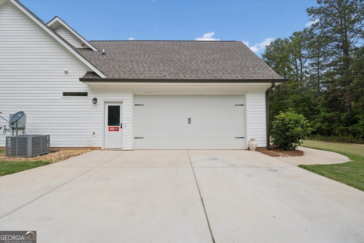 683 Teagle Road Forsyth, GA 31029 - Photo 38 of 50 a view of garage and yard