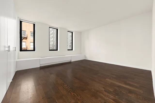 a bathroom with a double vanity sink toilet and shower