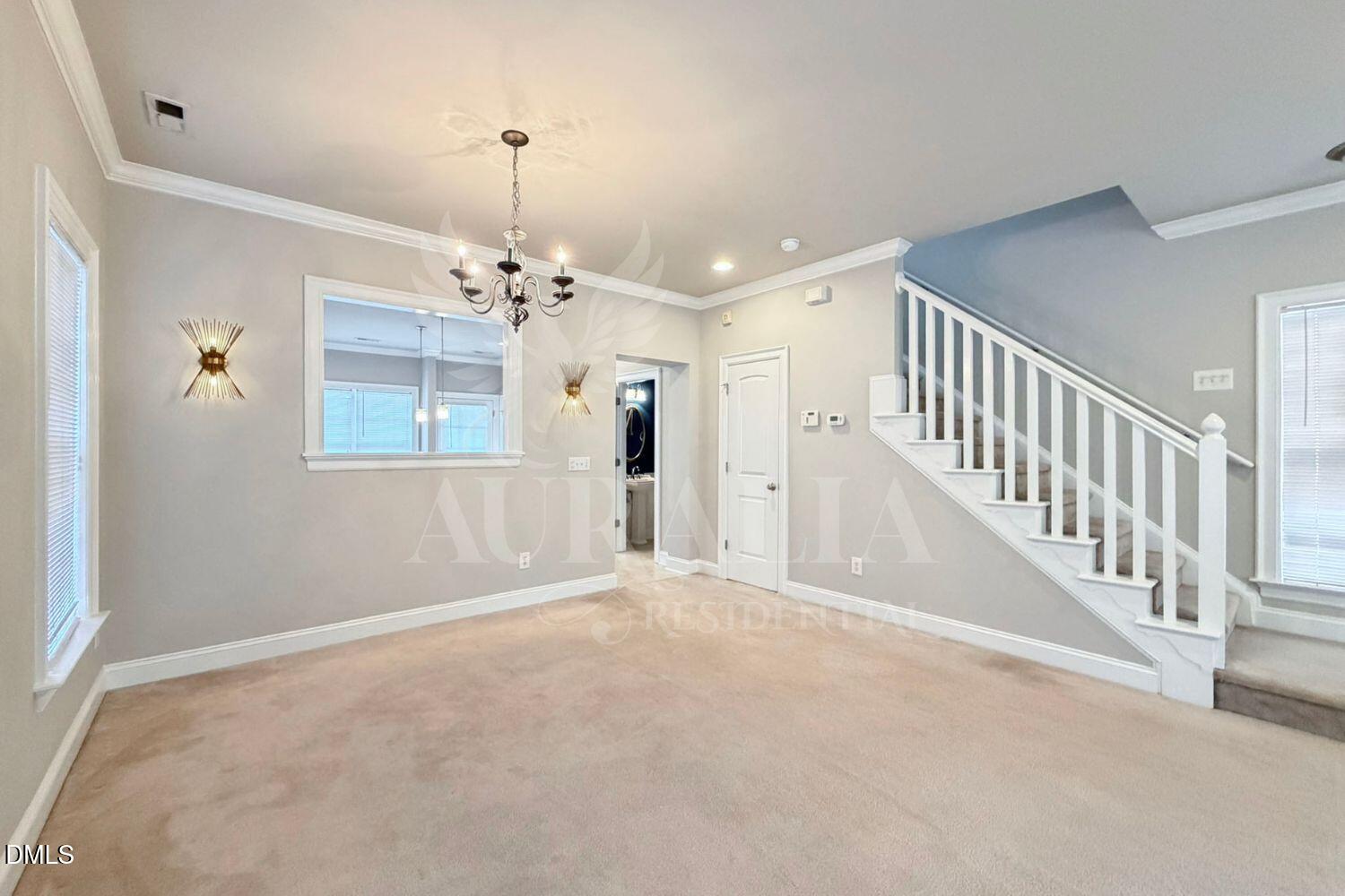 7754 ACC Boulevard Raleigh, NC 27617 - Photo 5 of 41 a view of a hallway with windows