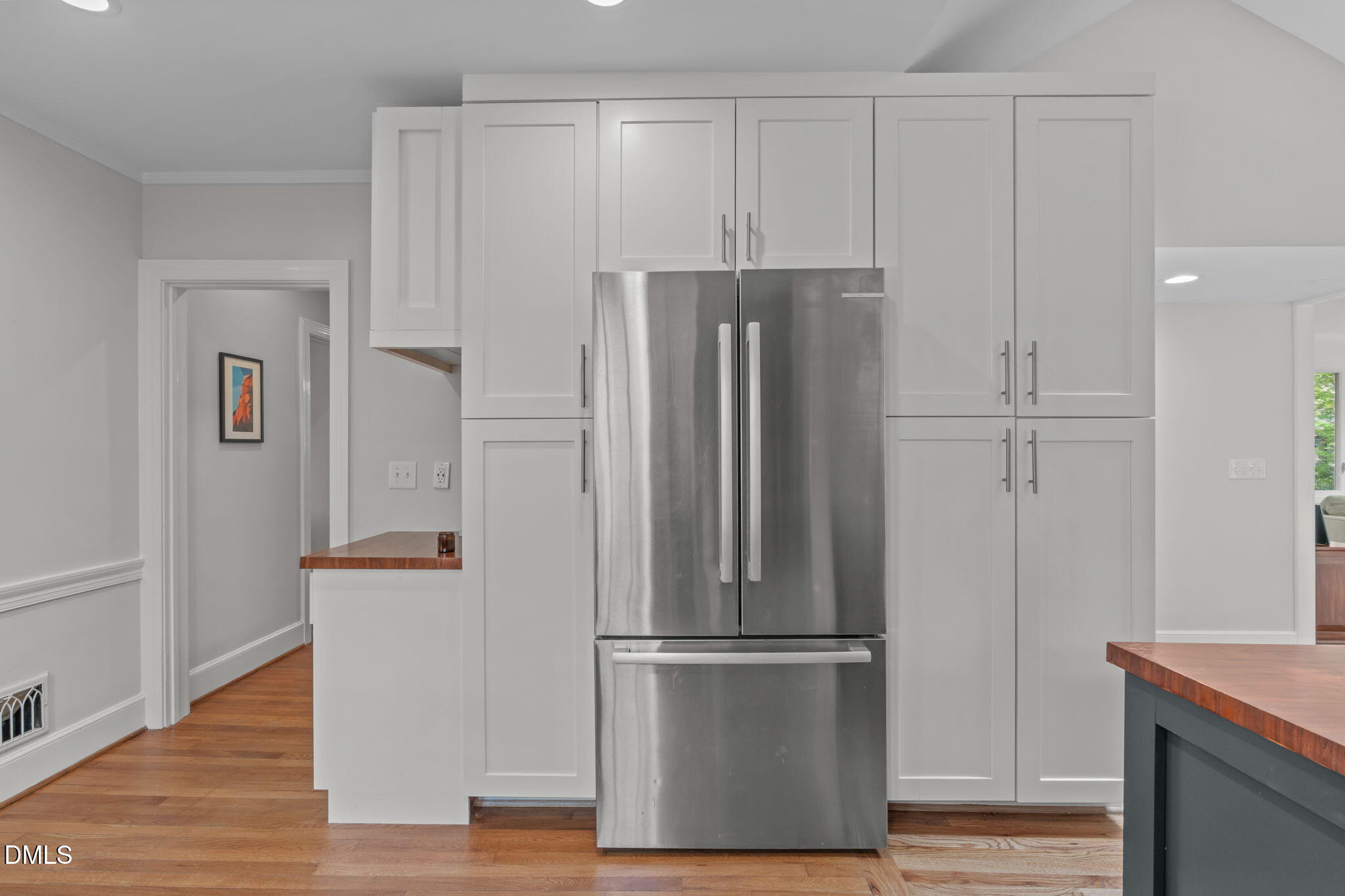 2111 Pershing Street Durham, NC 27705 - Photo 20 of 59 a view of kitchen with refrigerator and wooden floor