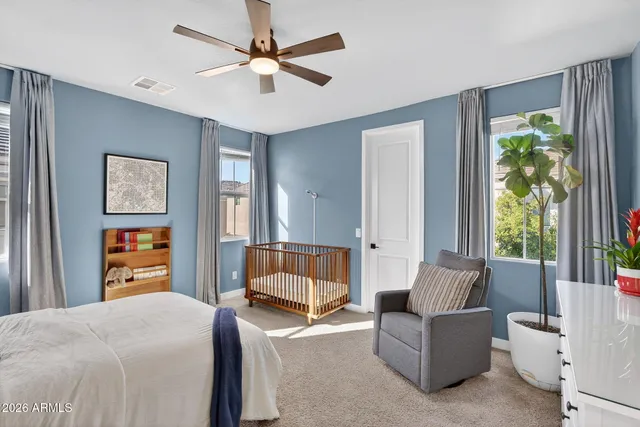 a bedroom with a bed and a dresser