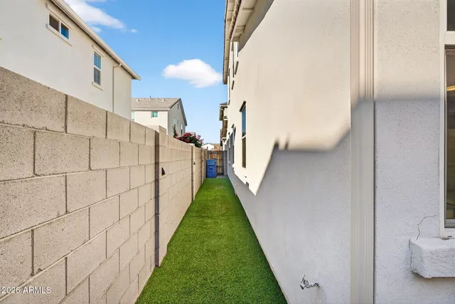 a view of a hallway with storage and utility room