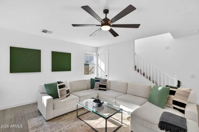 a view of a white house with a street