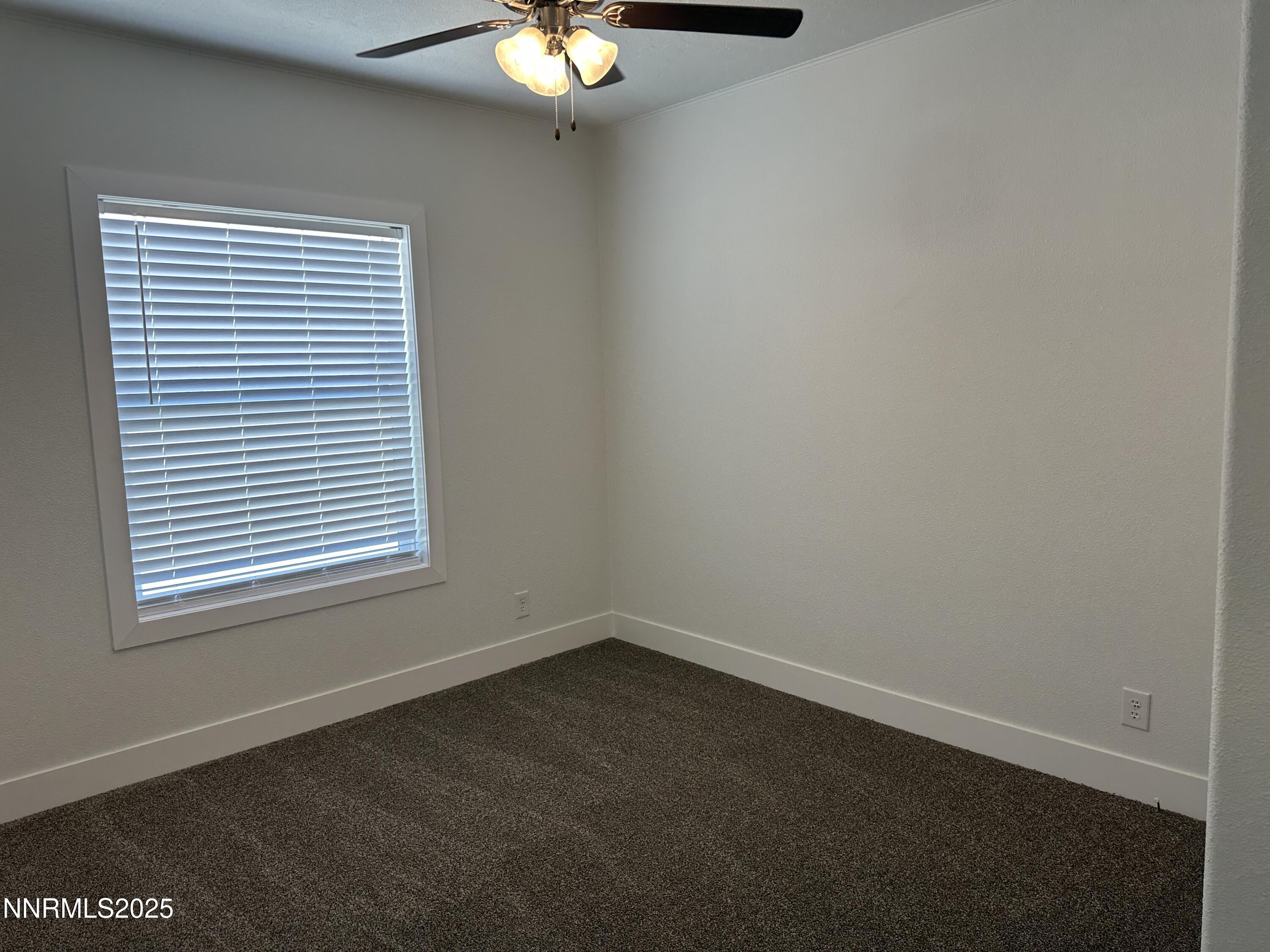7650 Sylvia Ridge Winnemucca, NV 89445 - Photo 11 of 16 an empty room with a window