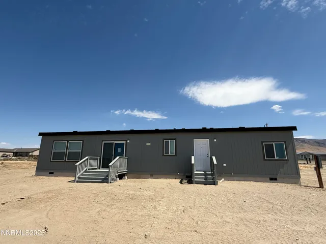 a view of a house with a barbeque and roof