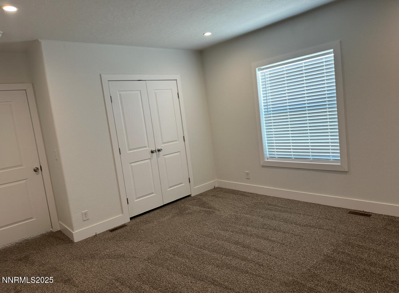 7650 Sylvia Ridge Winnemucca, NV 89445 - Photo 3 of 16 an empty room with a window