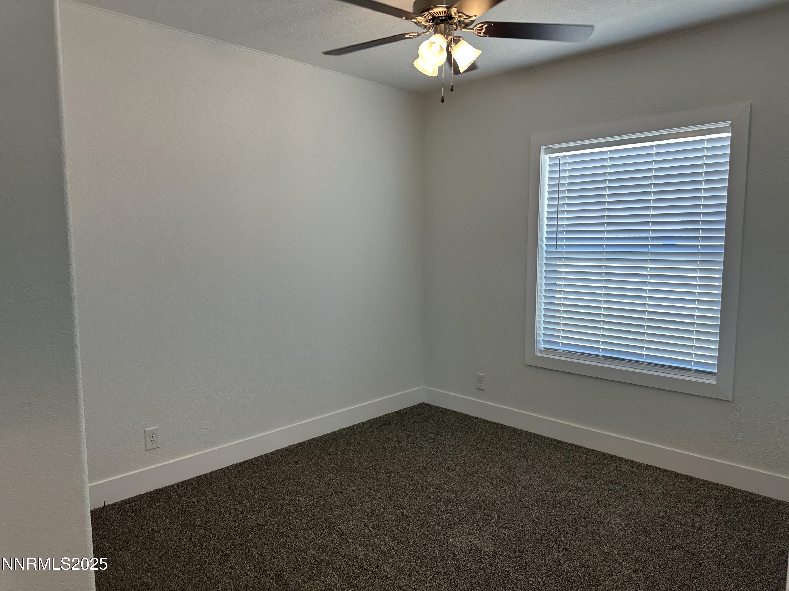 7650 Sylvia Ridge Winnemucca, NV 89445 - Photo 10 of 16 an empty room with a window