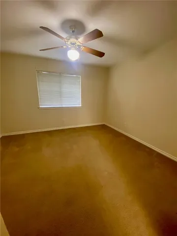 a view of a room with a large window