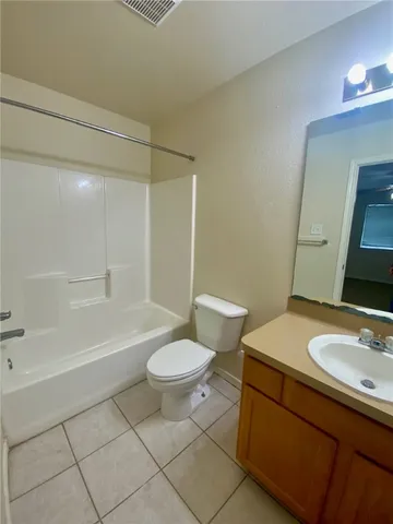 a bathroom with a sink toilet a mirror and shower