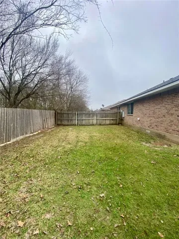 a swimming pool with wooden fence