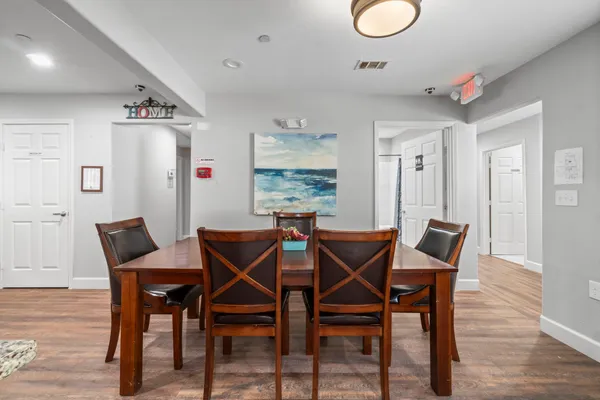 a kitchen with stainless steel appliances granite countertop a refrigerator a sink and a stove