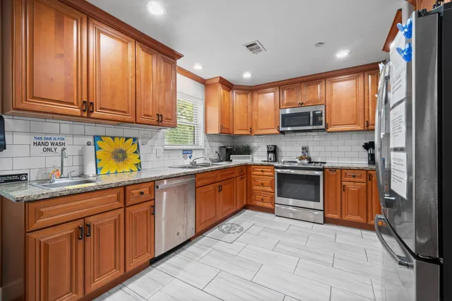 a kitchen with a table and chairs in it