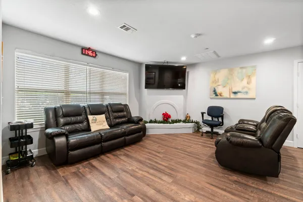 a view of a dining room with furniture and wooden floor