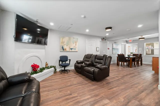a living room with furniture and a large window