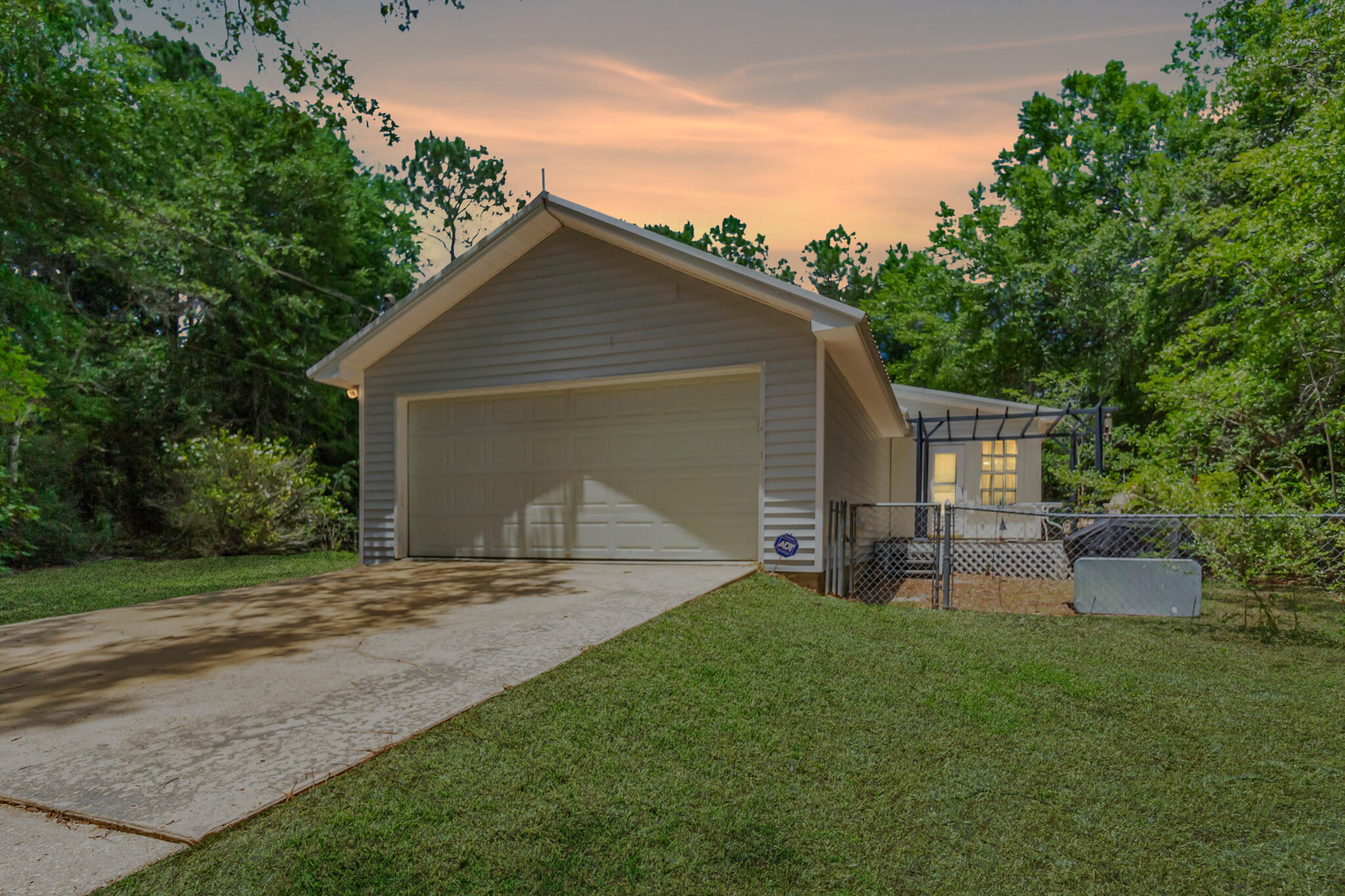 5957 Ridgecrest Road Crestview, FL 32539 - Photo 3 of 56 a view of a backyard with a garden and entertaining space
