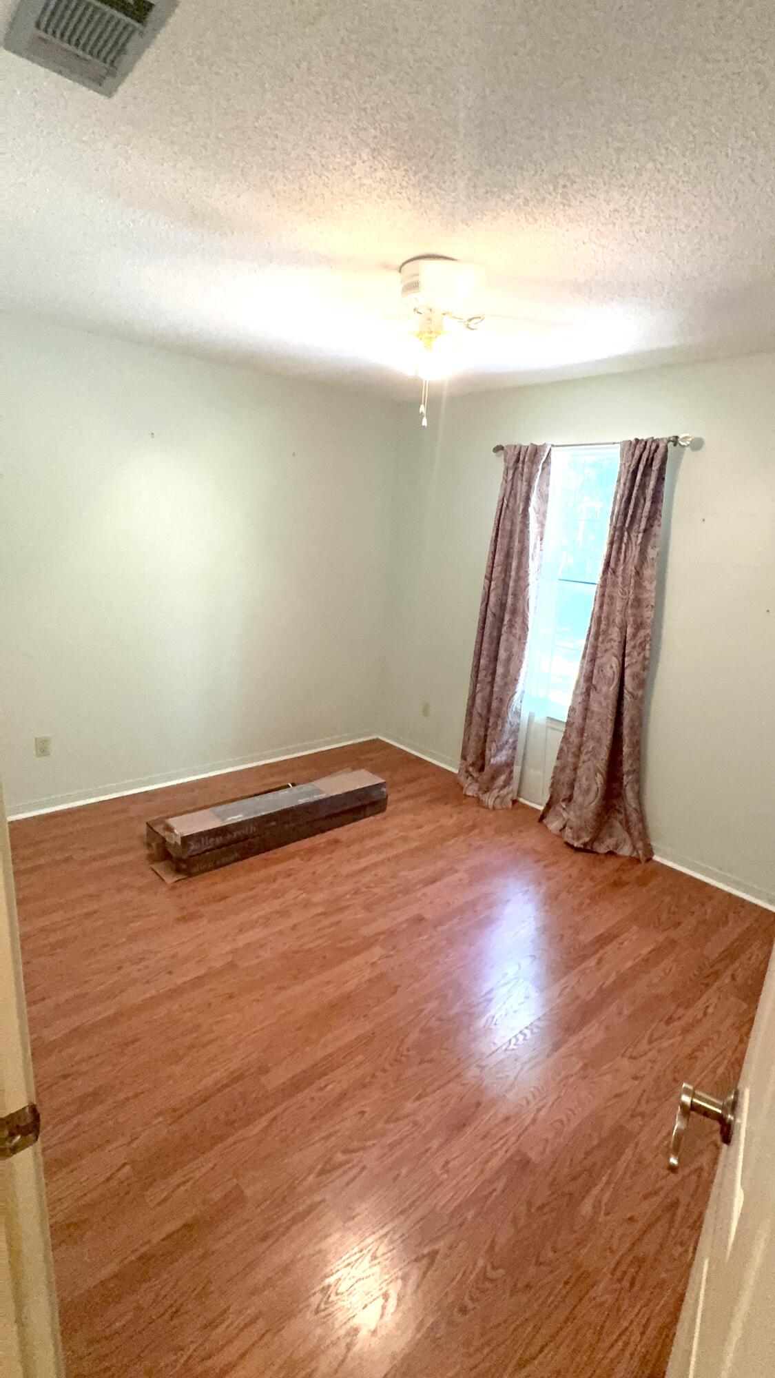 5957 Ridgecrest Road Crestview, FL 32539 - Photo 33 of 56 a view of a room with wooden floor