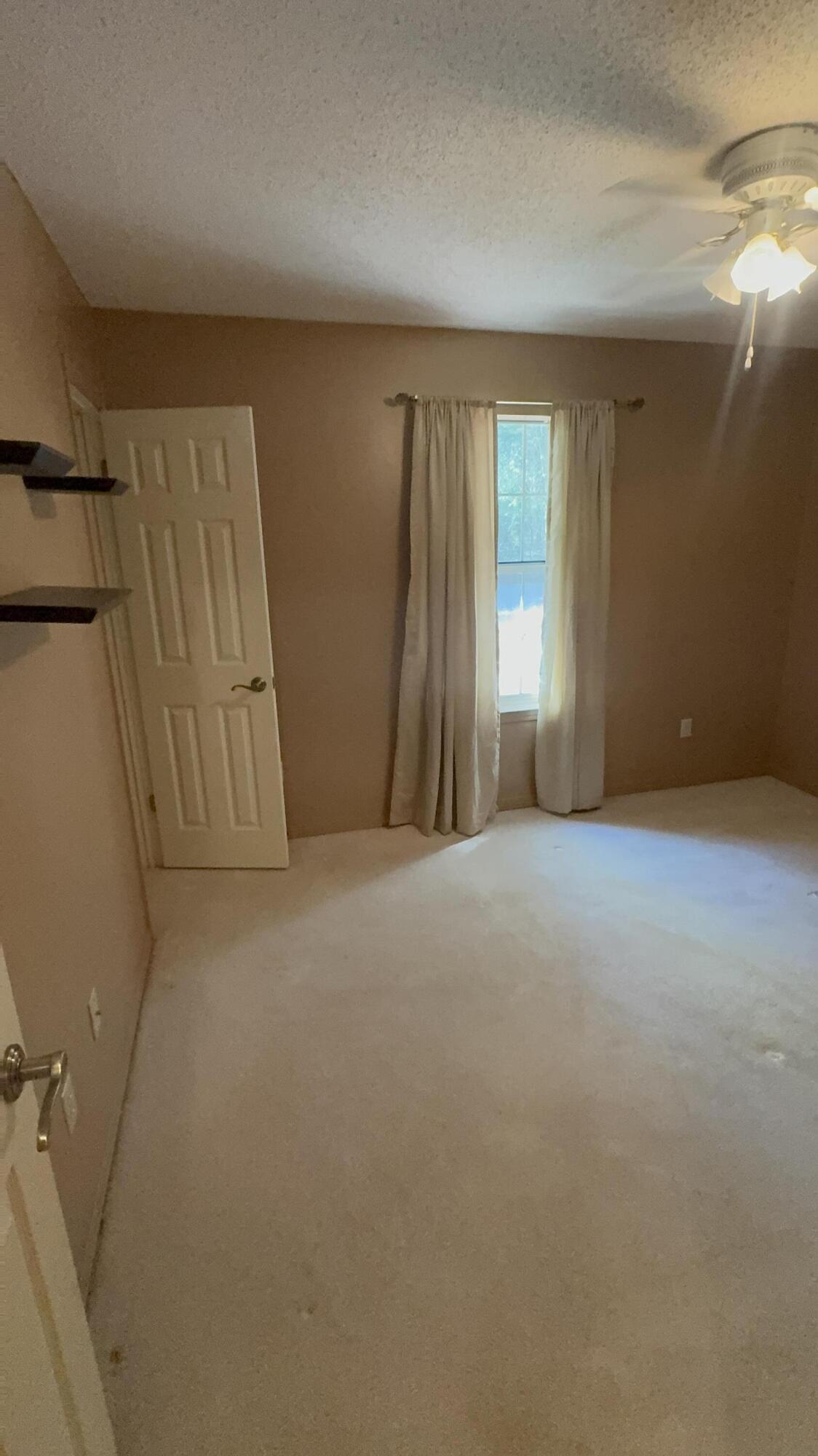 5957 Ridgecrest Road Crestview, FL 32539 - Photo 37 of 56 a view of an empty room with a fireplace