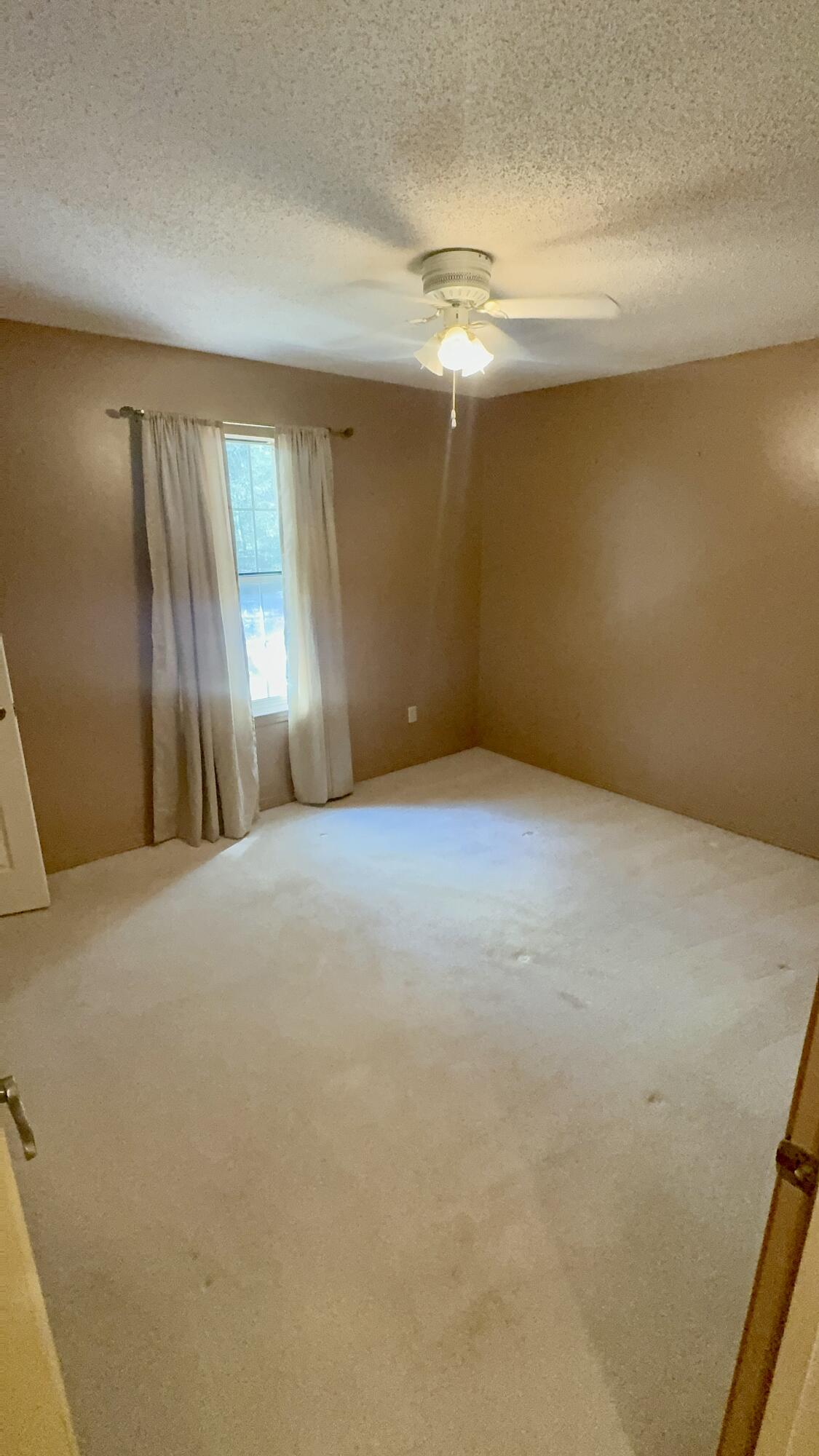5957 Ridgecrest Road Crestview, FL 32539 - Photo 38 of 56 a view of an empty room with a window