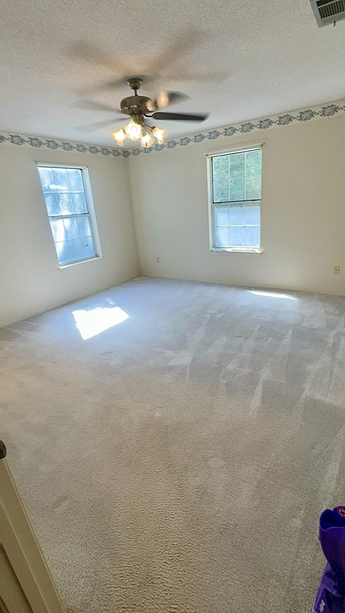5957 Ridgecrest Road Crestview, FL 32539 - Photo 41 of 56 en empty room with windows and closet